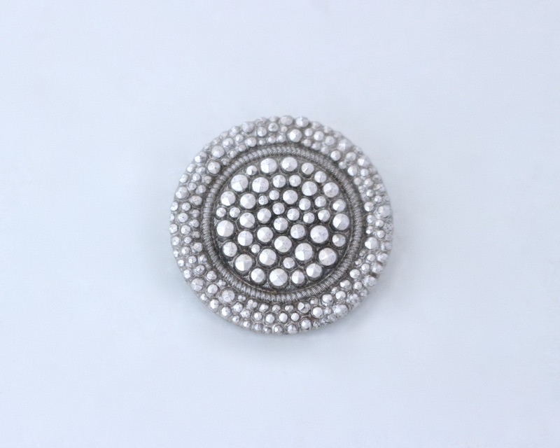 Steel cut button